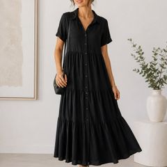 NEW black dress features a tiered skirt and short sleeves