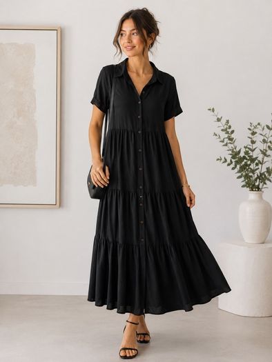 NEW black dress features a tiered skirt and short sleeves