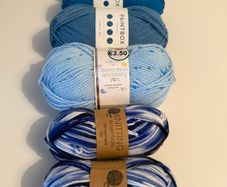 6 balls of blue yarn wool