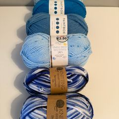6 balls of blue yarn wool