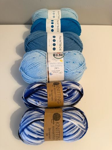 6 balls of blue yarn wool