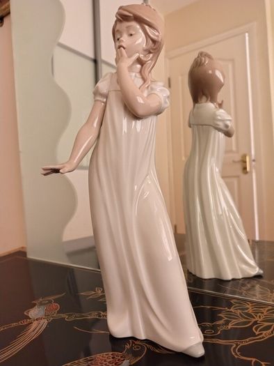 Nao by Lladro.  Yawning Girl. Damaged.