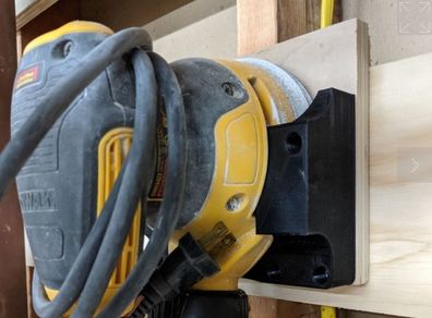 Wall mount for a Dewalt DWE6423 sander