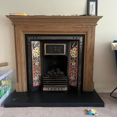 Wooden Fireplace with Tiled Cast Iron Surround
