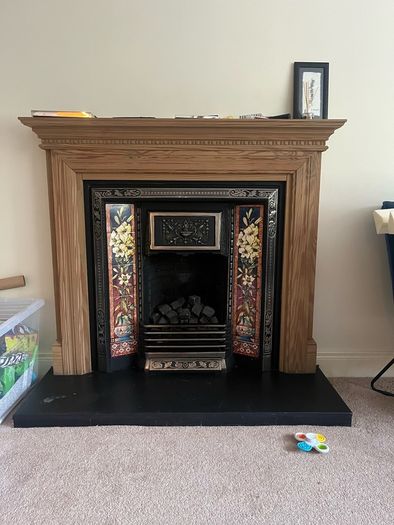 Wooden Fireplace with Tiled Cast Iron Surround