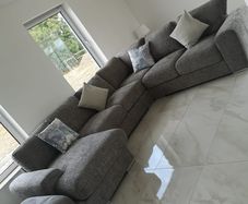Large L shaped couch with foot stool
