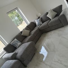 Large L shaped couch with foot stool