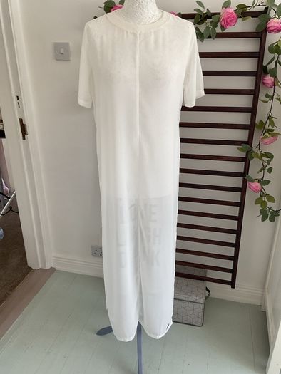 long tunic with side slits Bnwt.  Short sleeve white with black logo