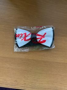 White with black bow tie