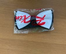 White with black bow tie