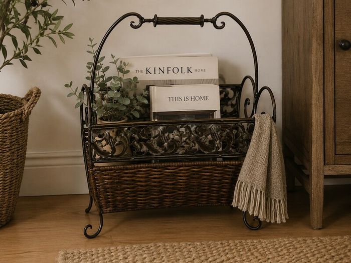 Antique iron and wicker magazine rack. Vintage antique magazine rack.