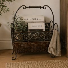 Antique iron and wicker magazine rack. Vintage antique magazine rack.