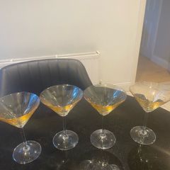 Set of four amber and plain glass martini or cocktail glasses