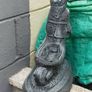Man holding a wheelbarrow garden gnome planter Image 2