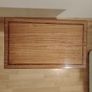 Small hardwood table with decorative inlaid border on both shelves. Image 2