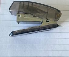 Compact SDI S-3 Mini Stapler Translucent smoke-grey body with sturdy metal stapling mechanism and built-in staple remover. In great working condition, lightweight, and perfect for home, office, or school pencil cases!
