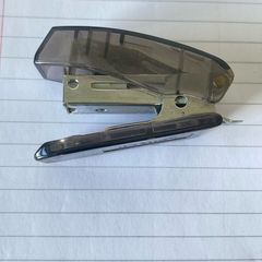 Compact SDI S-3 Mini Stapler Translucent smoke-grey body with sturdy metal stapling mechanism and built-in staple remover. In great working condition, lightweight, and perfect for home, office, or school pencil cases!