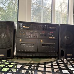 Radio and double cassette machine with speakers