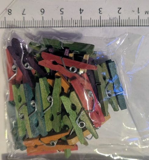 Pack of small coloured wooden pegs