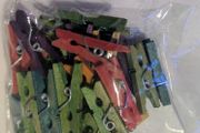 Pack of small coloured wooden pegs