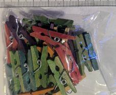 Pack of small coloured wooden pegs