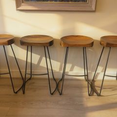 Premium Meadows & Byrne solid mango wood counter stools with powder-coated steel frames.