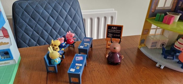 Assortment of peppa pig toys
