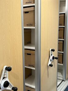Sliding stacked storage system on rails