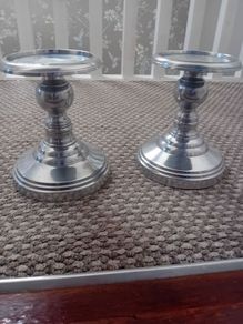 pair of metal pillar candle holders
