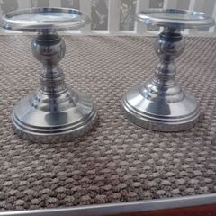 pair of metal pillar candle holders