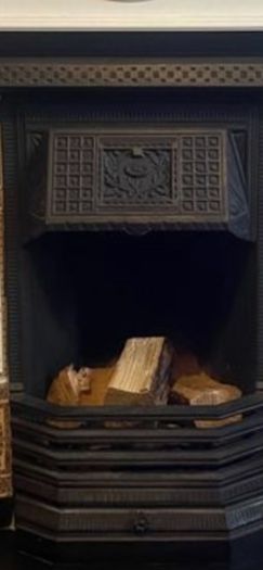 cast iron fireplace with timber surround
