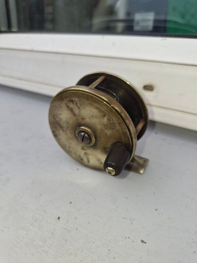 old  brass  fishing real