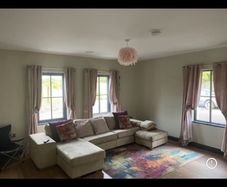 Large L-shaped cream couch
