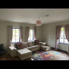 Large L-shaped cream couch