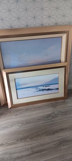 Two gold frame pictures with boats