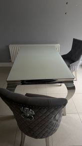 table and 2 plush velvet knocker chairs