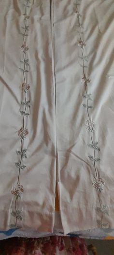 A pair of vintage embroidered curtains