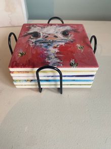 Set of five ceramic tile animal coasters with holder