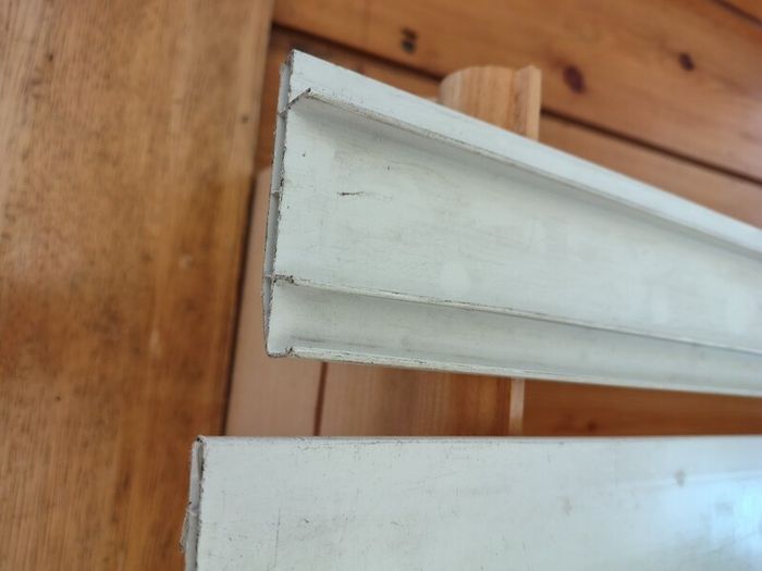 Two 2.6m white plastic lengths.