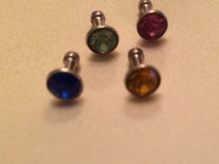 Brand new 8 pack of diamond plug in dust covers for phone and tablets