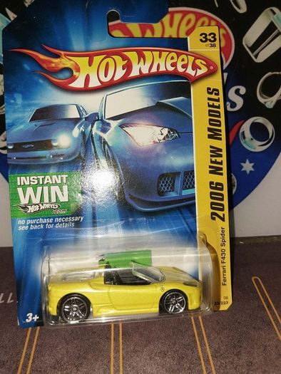 Hot Wheels Ferrari die-cast model cars from the mid-2000s and late 1990s card collections.