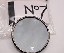 Magnifying suction mirror