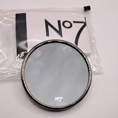 Magnifying suction mirror
