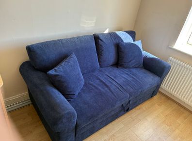 Blue corduroy sofa bed