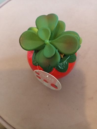 Faux succulent in strawberry vase