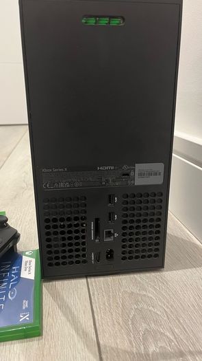xbox series X with original controller and Jurassic World evolution two and halo infinity