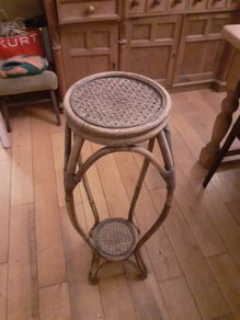 Rattan plant stand.
