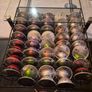 nespresso vertuo plus machine and coffee pods with holding tray Image 4