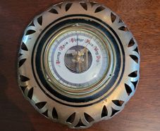 Antique brass weather barometer
