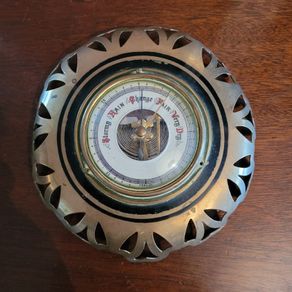 Antique brass weather barometer